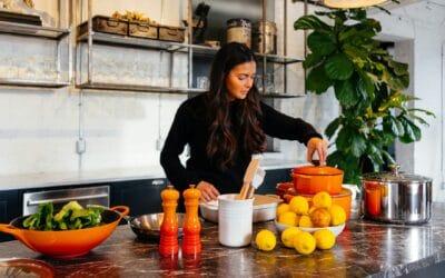 Woman Cooking in kitchen with food on the counter